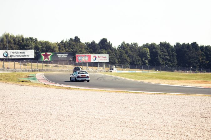 Citroen Saxo and Peugeot 106 racing around the first corner