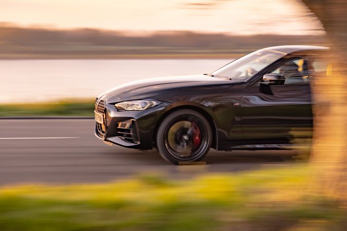 BMW M440i xDrive Coupe Driving on road