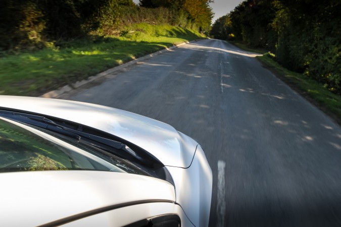 Mazda2 Sport Nav white driving looking over bonnet