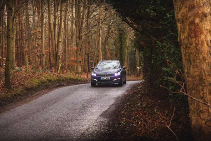 Peugeot 508 SW GT Car Driving Over Hill