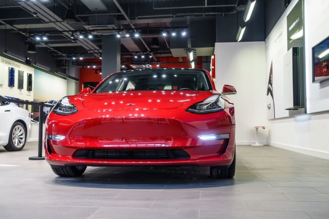 Tesla Model 3 In Store Front Red