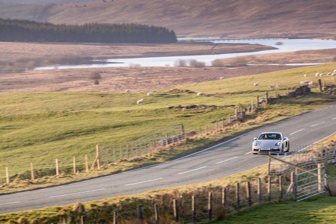 Porsche Cayman GTS on a country road