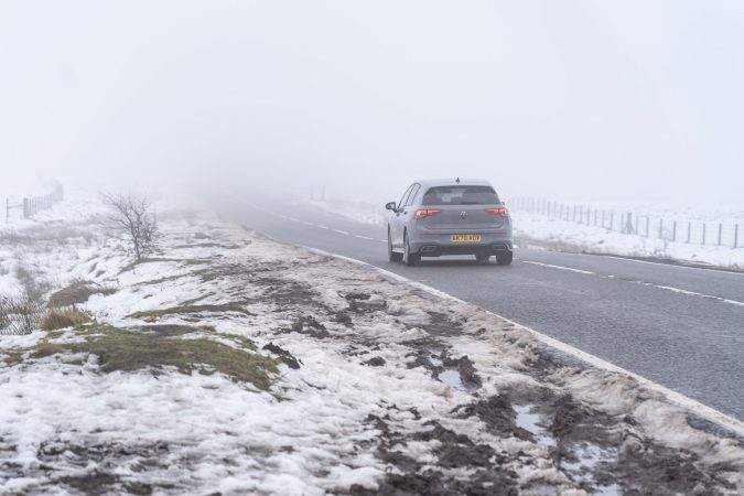 VW Gold Driving On Icey Road