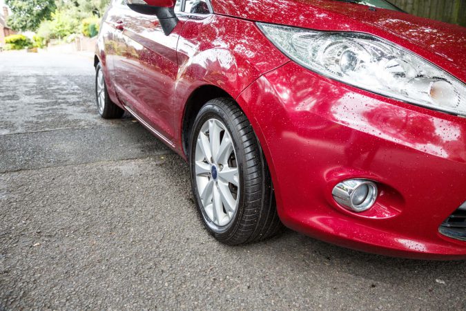 Ford Fiesta red with a new set of tyres (tires) replacement best brands