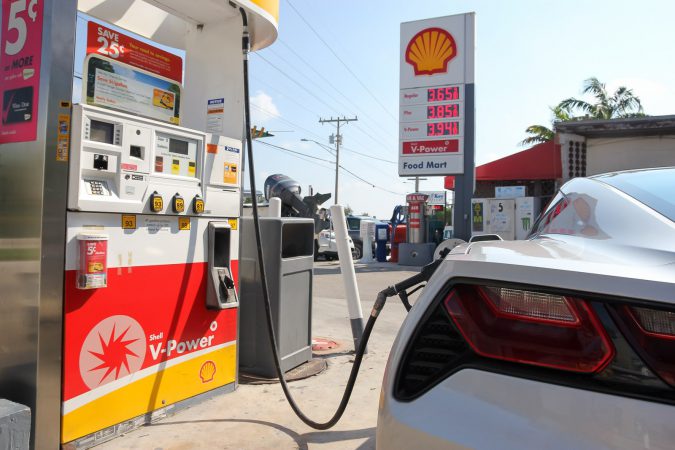 Fuel shell station pump filling up Chevrolet Corvette